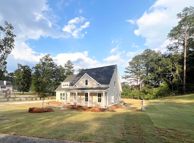 view of front of property with covered porch and a front lawn