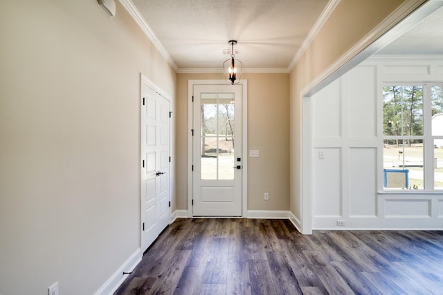 foyer with baseboards, dark wood-style floors, and crown molding