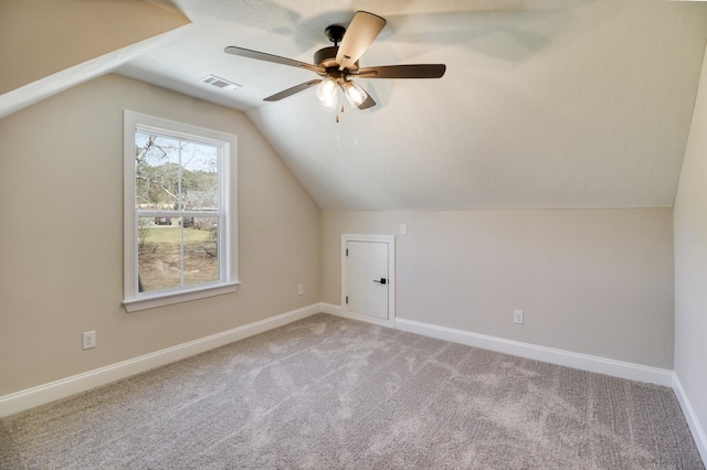 bonus room with visible vents, baseboards, carpet, and ceiling fan