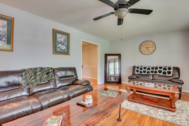 3114 Sussex Rd, Augusta, GA 30909 - living area with a textured ceiling, wood finished floors, and a ceiling fan