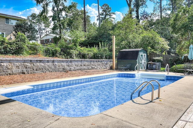 3114 Sussex Rd, Augusta, GA 30909 - view of swimming pool featuring a storage unit, a fenced backyard, view of wooded area, and a patio area