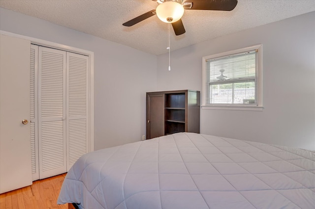 3114 Sussex Rd, Augusta, GA 30909 - bedroom with wood finished floors, a closet, a textured ceiling, and a ceiling fan