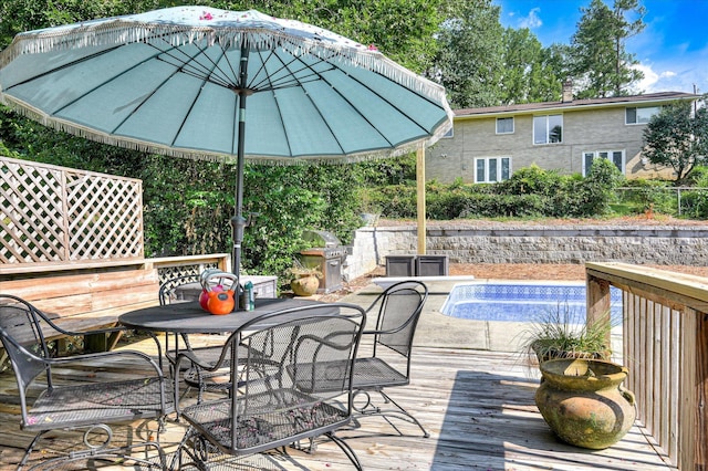 3114 Sussex Rd, Augusta, GA 30909 - wooden deck with outdoor dining space, a pool, and a grill