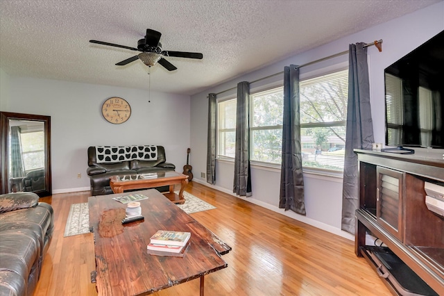 3114 Sussex Rd, Augusta, GA 30909 - living room with a textured ceiling, a ceiling fan, and light wood-style flooring