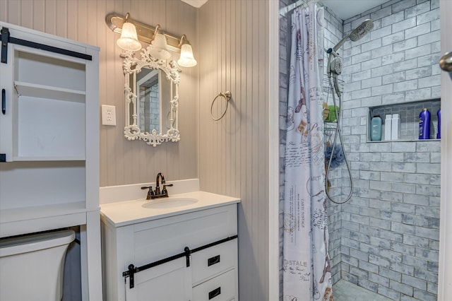 3114 Sussex Rd, Augusta, GA 30909 - bathroom with vanity, tiled shower, and wood walls