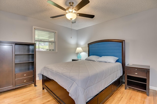 3114 Sussex Rd, Augusta, GA 30909 - bedroom featuring light wood-style flooring, a textured ceiling, and a ceiling fan