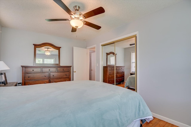 3114 Sussex Rd, Augusta, GA 30909 - bedroom featuring light wood-style floors, a closet, ceiling fan, and a textured ceiling