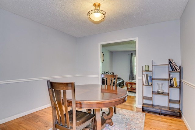 3114 Sussex Rd, Augusta, GA 30909 - dining area featuring wood finished floors and a textured ceiling