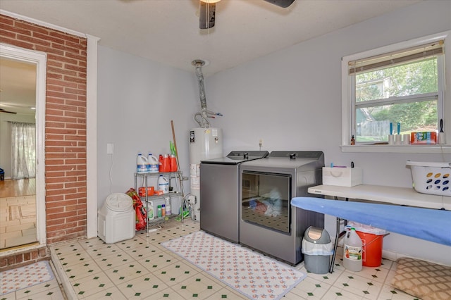 3114 Sussex Rd, Augusta, GA 30909 - laundry room with washer and clothes dryer, a ceiling fan, gas water heater, and brick wall