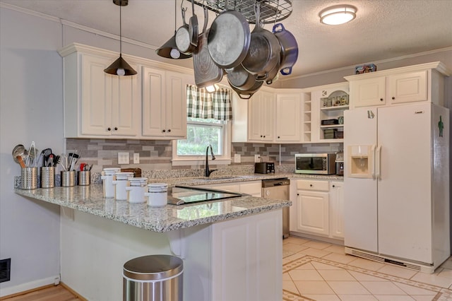 3114 Sussex Rd, Augusta, GA 30909 - kitchen featuring appliances with stainless steel finishes, a peninsula, open shelves, backsplash, and light tile patterned floors