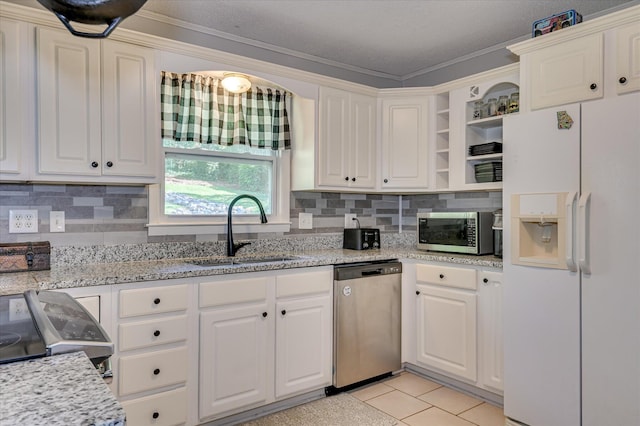 3114 Sussex Rd, Augusta, GA 30909 - kitchen featuring appliances with stainless steel finishes, open shelves, white cabinetry, decorative backsplash, and crown molding