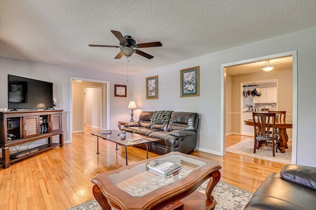 3114 Sussex Rd, Augusta, GA 30909 - living area with ceiling fan, light wood finished floors, and a textured ceiling
