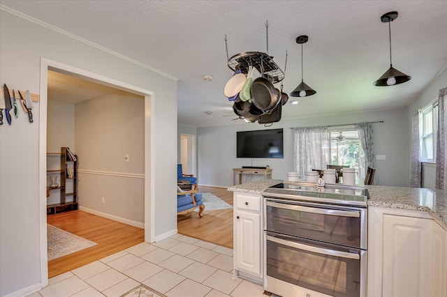 3114 Sussex Rd, Augusta, GA 30909 - kitchen featuring light wood-type flooring, open floor plan, white cabinetry, light stone counters, and crown molding