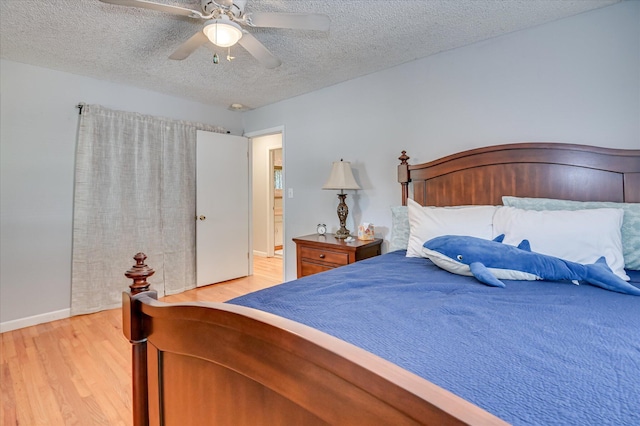 3114 Sussex Rd, Augusta, GA 30909 - bedroom with light wood finished floors, a textured ceiling, and ceiling fan