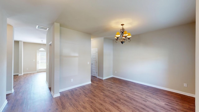 195 Sims Ct, Augusta, GA 30909 - spare room featuring a chandelier and dark wood-style floors