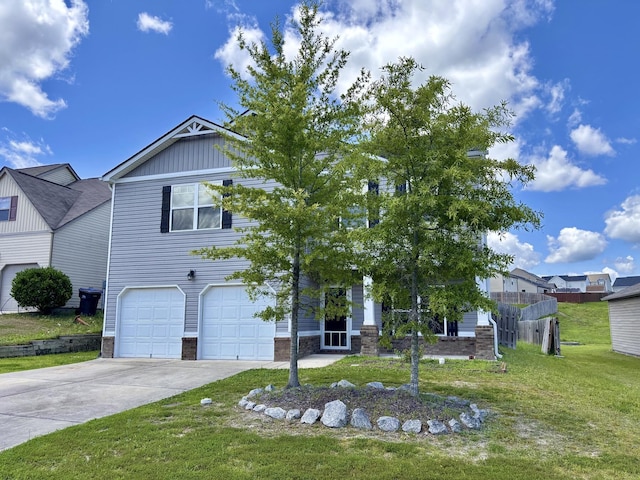 195 Sims Ct, Augusta, GA 30909 - view of front of house with a front lawn, driveway, and a garage