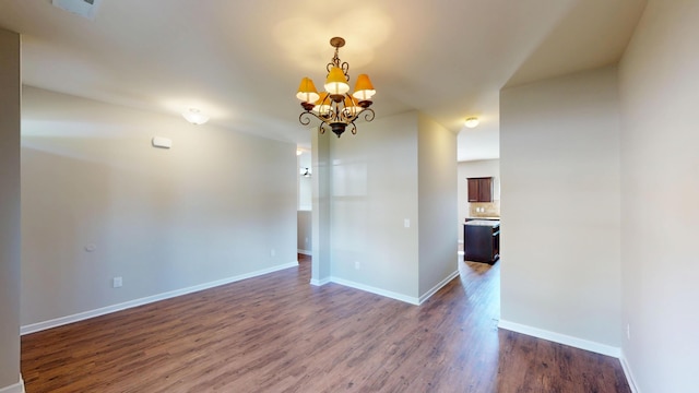 195 Sims Ct, Augusta, GA 30909 - unfurnished room featuring dark wood-style flooring and a chandelier