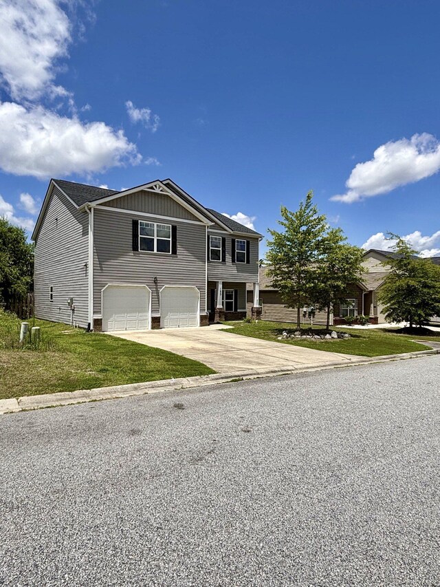 195 Sims Ct, Augusta, GA 30909 - view of front of house featuring an attached garage, driveway, and a front lawn