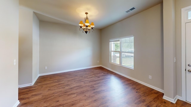 195 Sims Ct, Augusta, GA 30909 - unfurnished room with a chandelier and dark wood-style floors