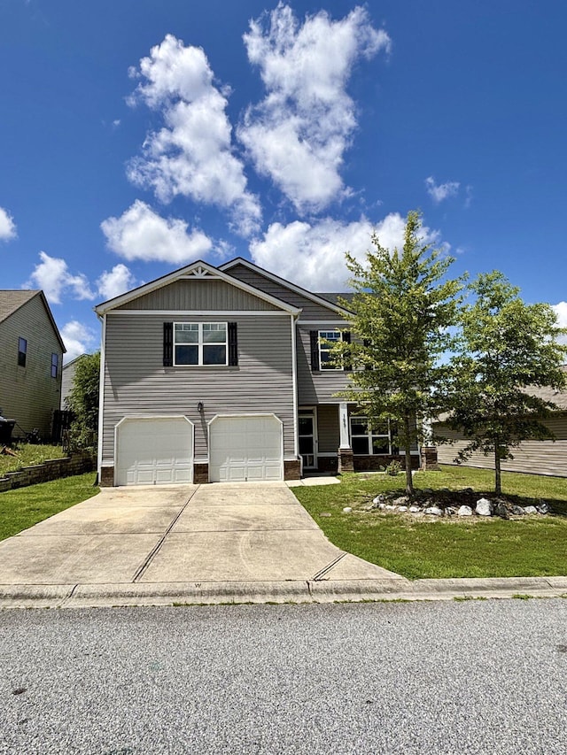 195 Sims Ct, Augusta, GA 30909 - view of front of house with an attached garage, concrete driveway, board and batten siding, and a front yard
