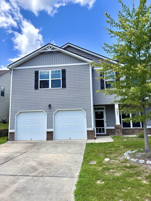 195 Sims Ct, Augusta, GA 30909 - view of front of property with brick siding, an attached garage, driveway, and a front lawn