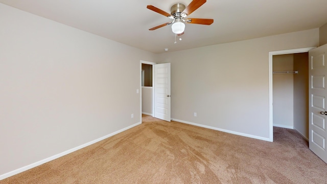 195 Sims Ct, Augusta, GA 30909 - unfurnished bedroom featuring light colored carpet, a walk in closet, and ceiling fan