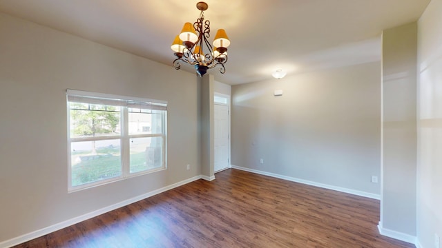 195 Sims Ct, Augusta, GA 30909 - unfurnished room with a chandelier and dark wood-style flooring