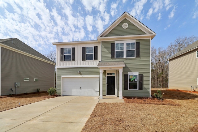 traditional-style home with concrete driveway, a garage, and board and batten siding