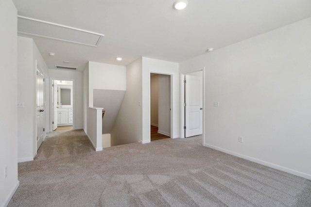 unfurnished room featuring recessed lighting, visible vents, baseboards, and carpet flooring