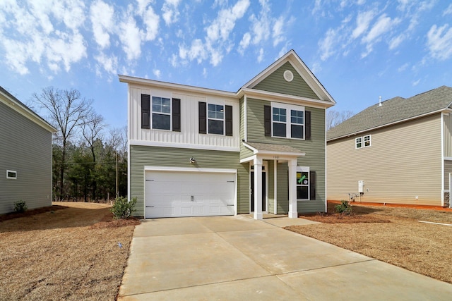 traditional home featuring an attached garage, board and batten siding, and driveway