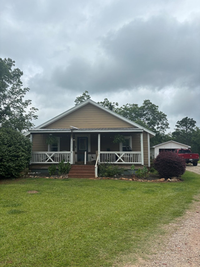 2023 Gamble School Rd, Stapleton, GA 30823 - view of front of property featuring a porch and a front lawn