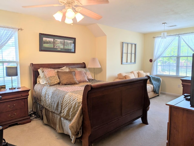 bedroom with light carpet, ceiling fan, and baseboards