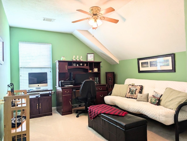 home office featuring light colored carpet, ceiling fan, and lofted ceiling