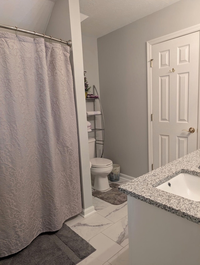 full bath with marble finish flooring, toilet, baseboards, and vanity
