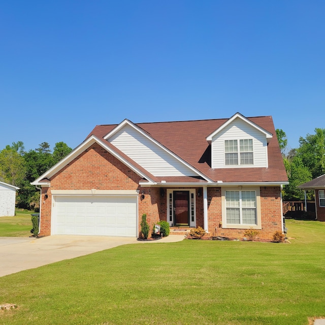 view of front of home featuring a garage, driveway, a front yard, and brick siding