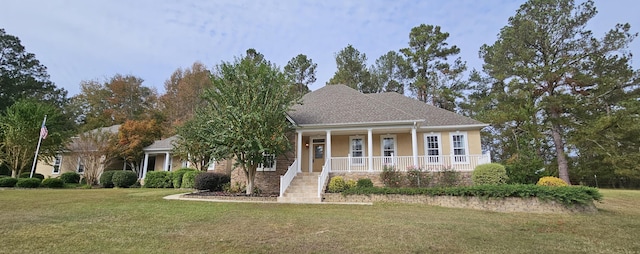 view of front of home with a porch and a front yard