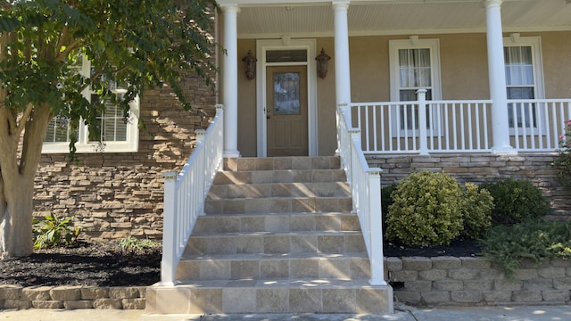 doorway to property featuring a porch