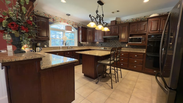 kitchen with a center island, a kitchen breakfast bar, crown molding, dark brown cabinetry, and stainless steel appliances