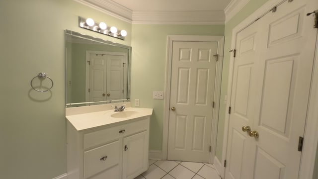 bathroom featuring tile patterned flooring, vanity, and crown molding