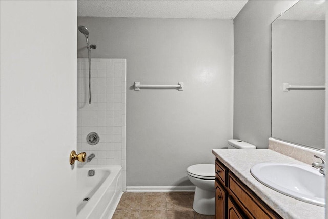 full bath with washtub / shower combination, a textured ceiling, baseboards, toilet, and vanity