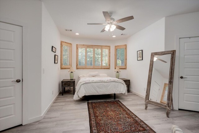 bedroom featuring ceiling fan and light hardwood / wood-style floors