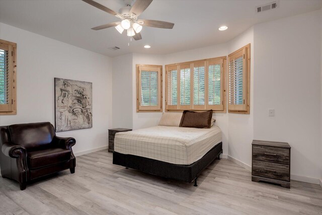 bedroom with light wood-type flooring and ceiling fan