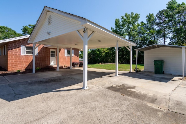 view of parking / parking lot featuring driveway and a carport