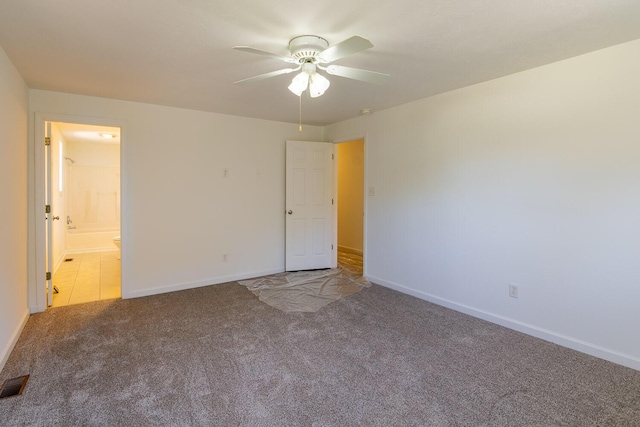 interior space featuring visible vents, baseboards, a ceiling fan, and carpet floors