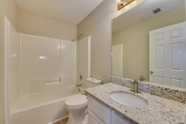 bathroom featuring visible vents, vanity, toilet, and shower / tub combination