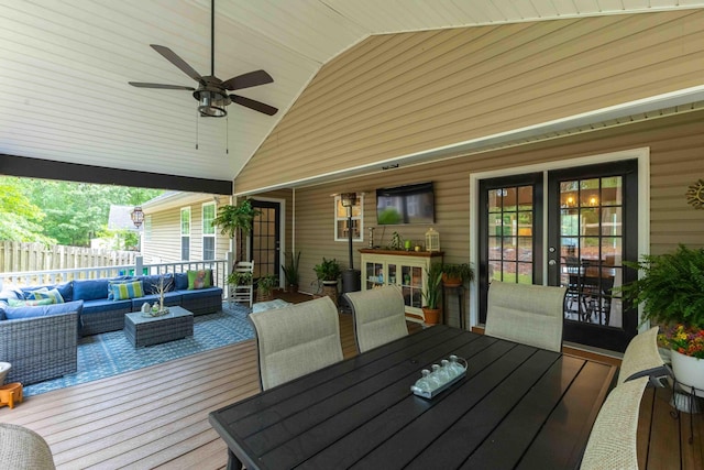 wooden terrace featuring outdoor lounge area, fence, outdoor dining area, and a ceiling fan