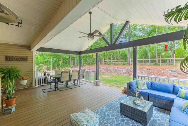deck with an outdoor hangout area, a ceiling fan, outdoor dining area, and fence
