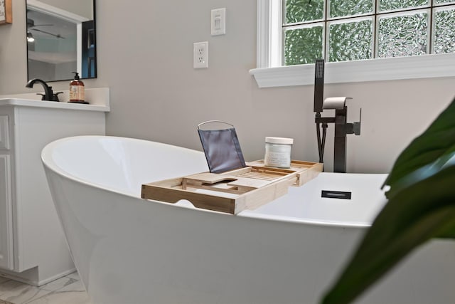 home office with marble look tile flooring