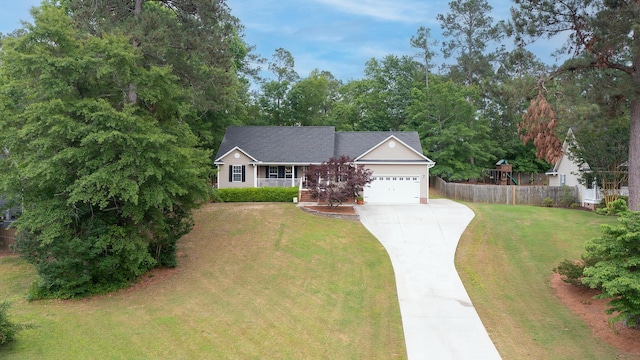 view of front of home featuring driveway, a porch, and a garage