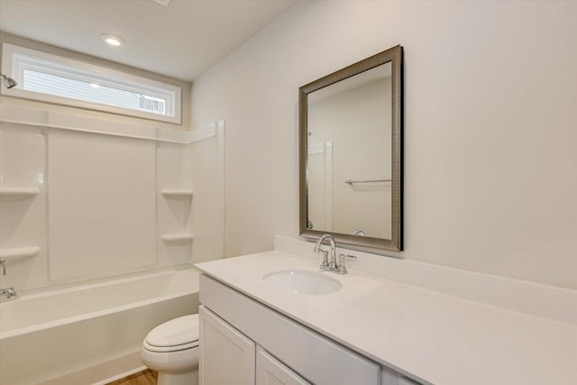 full bath with shower / bathtub combination, vanity, and toilet